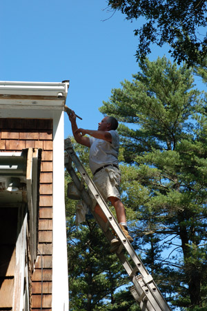 Photo of Phil Hammond applying primer